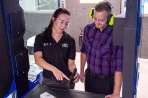 A woman answering frequently asked questions
